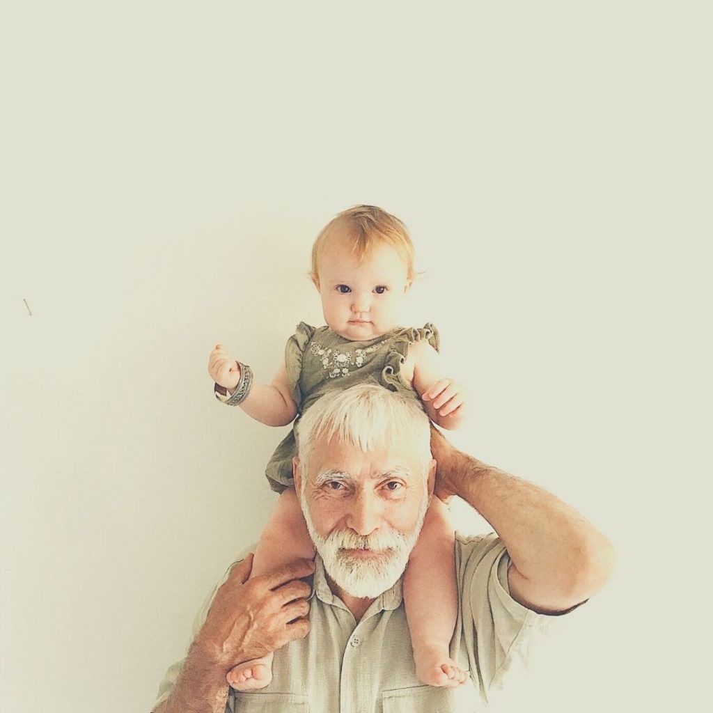 picture of grandfather with baby on his shoulders